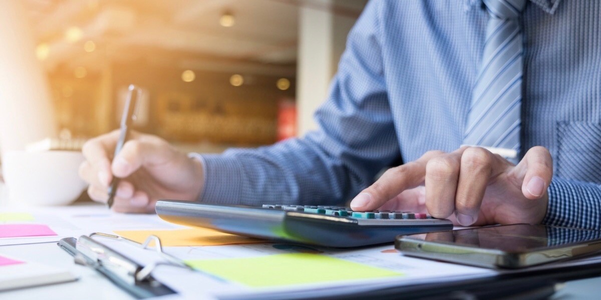 Accountant doing calculations with a calculator