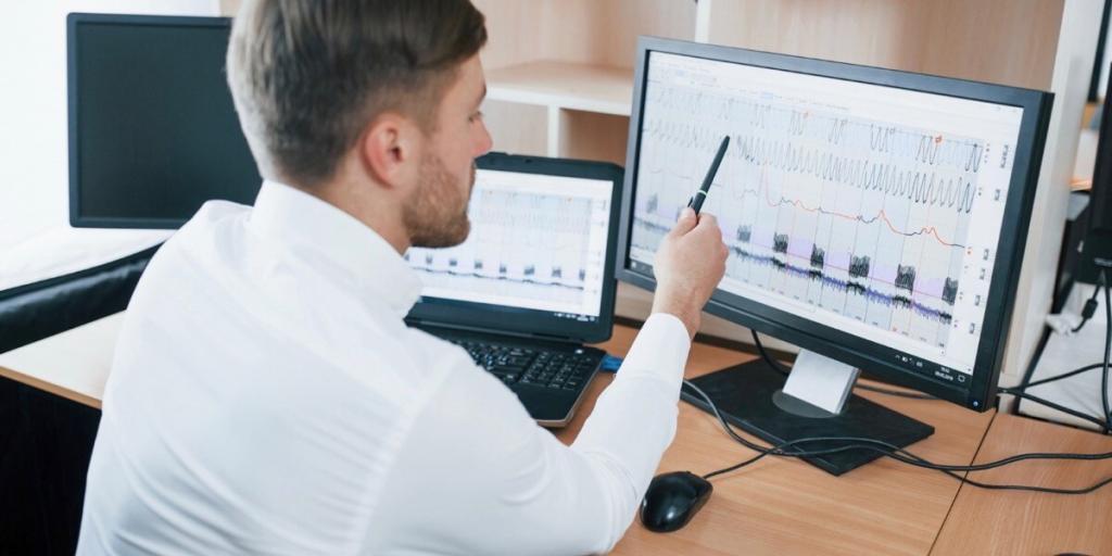 Man examining analysis on computer