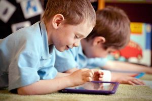 Child playing with tablet